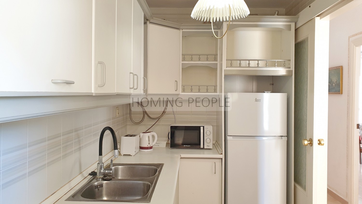 Apartamento luminoso en edificio de primera línea de playa con piscina y aparcamiento
