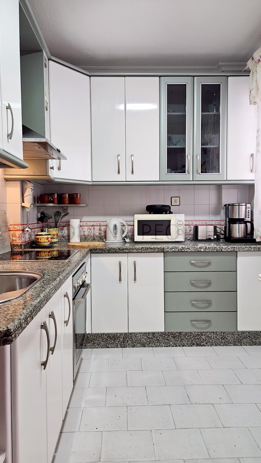 Central flat: Opposite the municipal market, with terrace and communal swimming pool