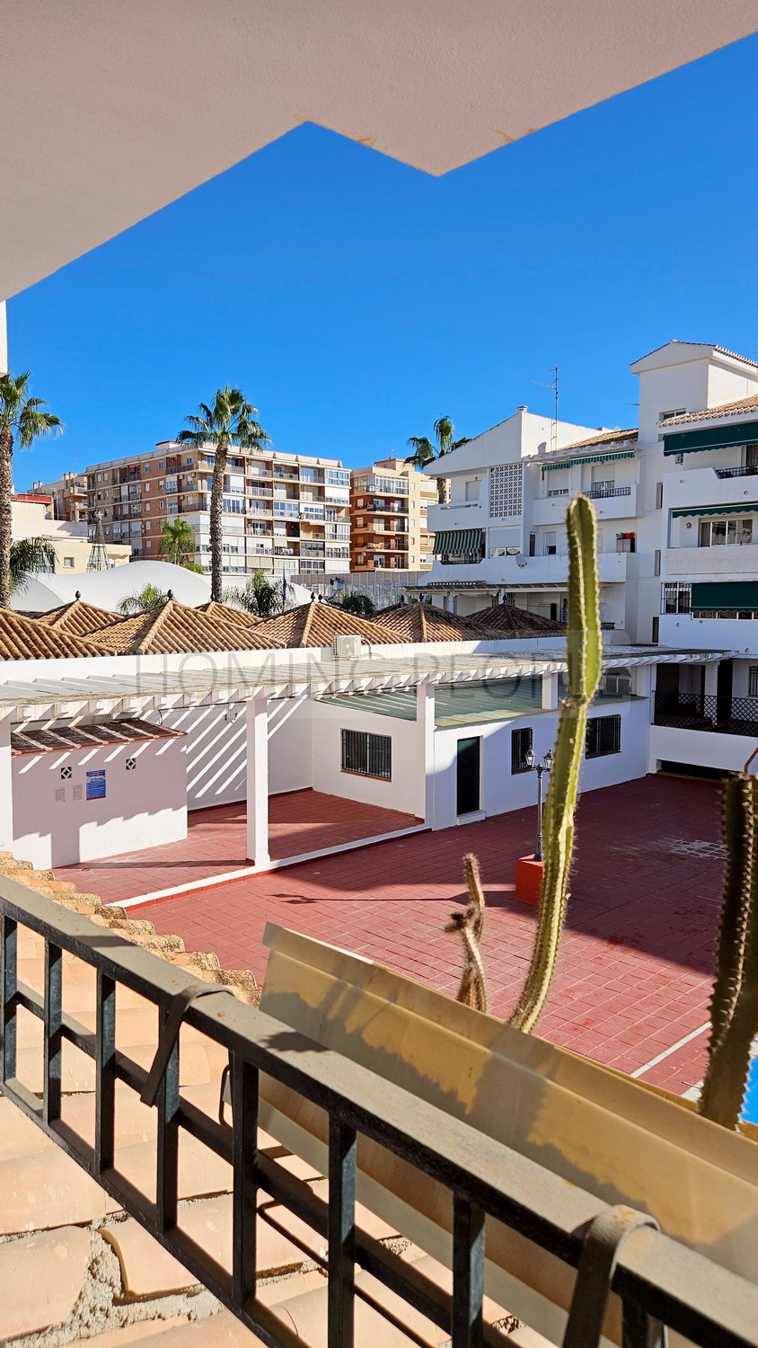 Central flat: Opposite the municipal market, with terrace and communal swimming pool