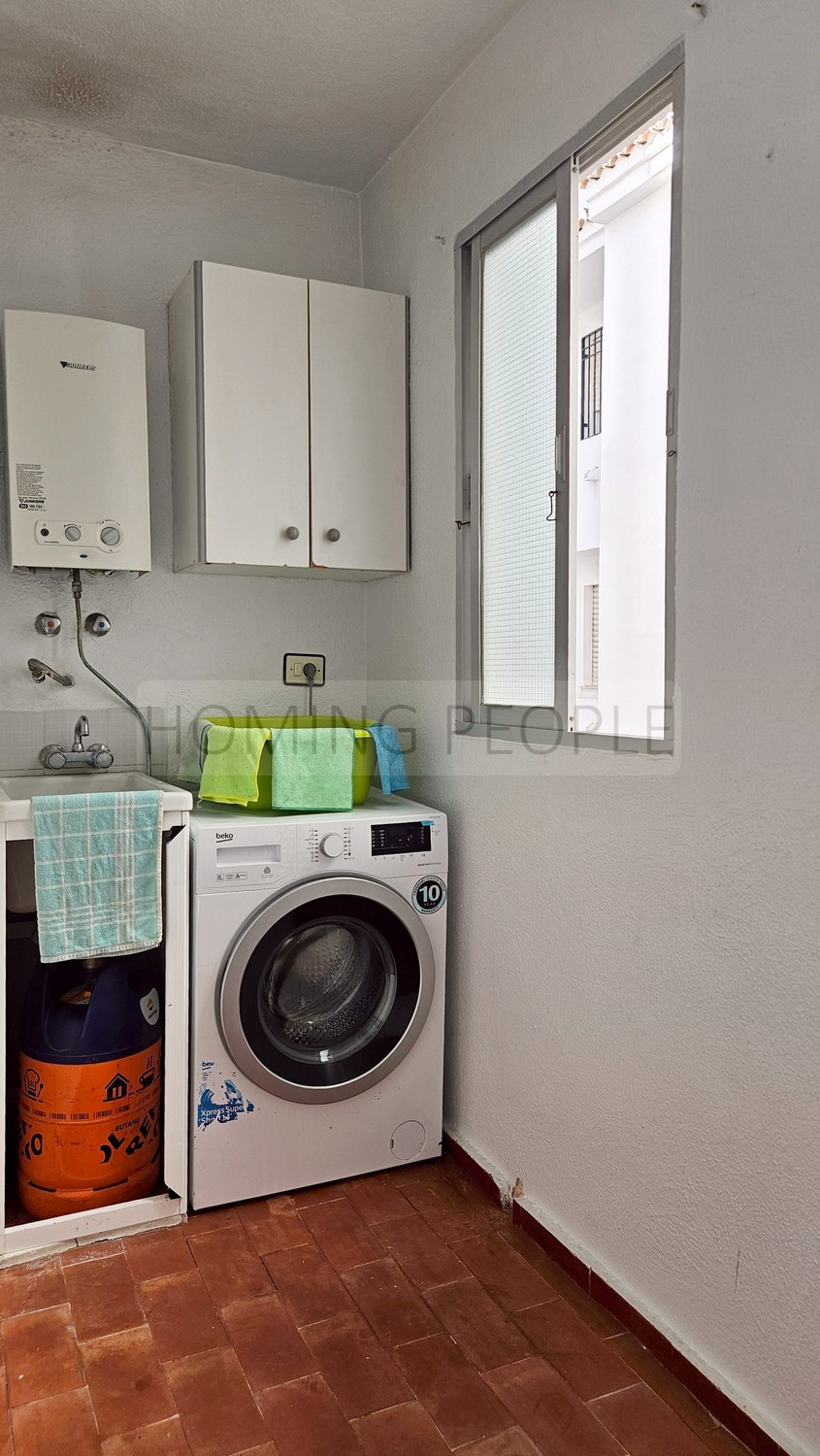 Central flat: Opposite the municipal market, with terrace and communal swimming pool