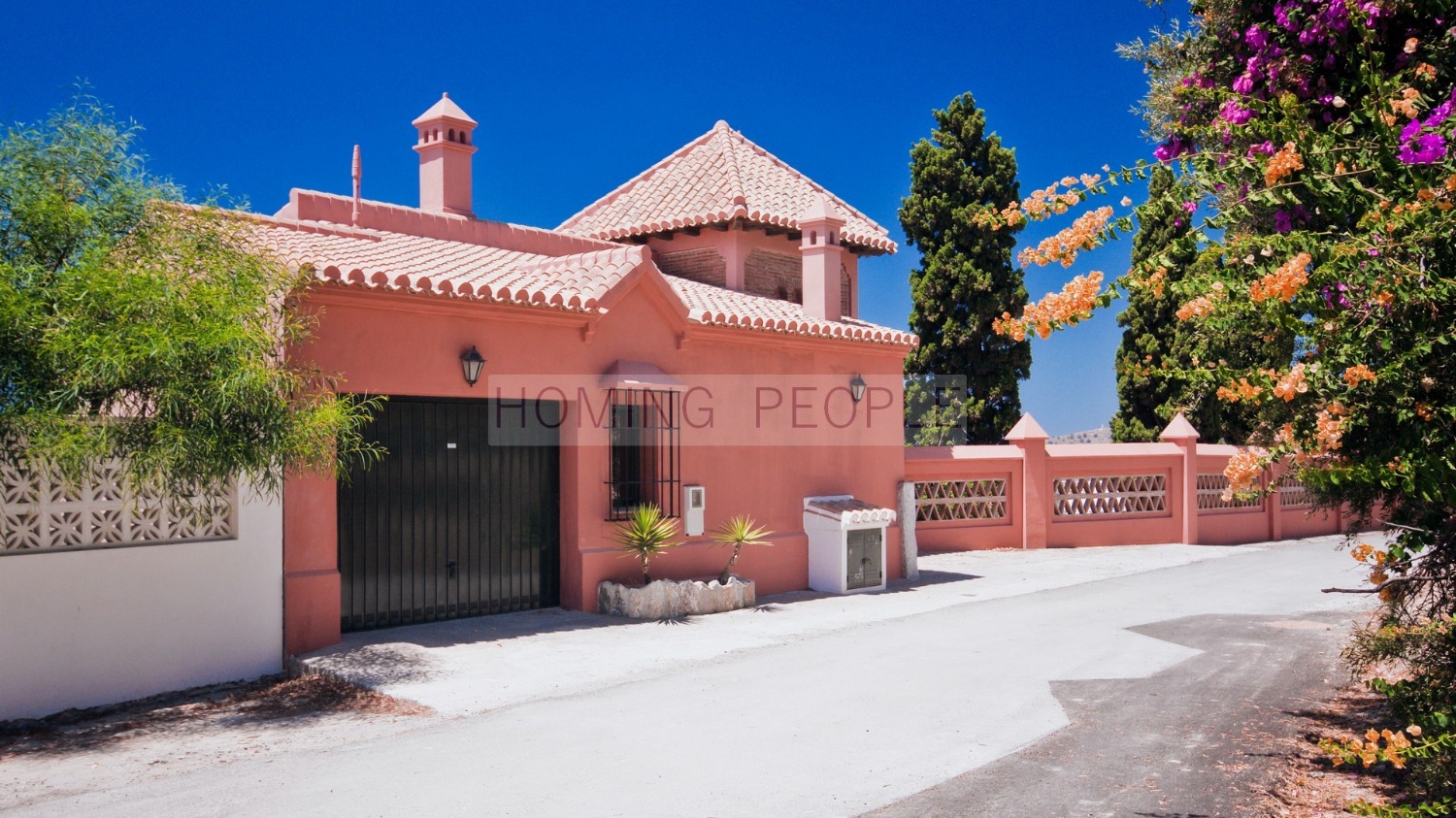 Immaculate villa featuring mature gardens with a pool and a guest house.